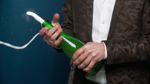 Hands Opening the Champagne Bottle