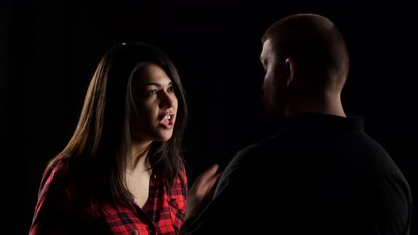 Close-up of Woman Arguing with Her Boyfriend on Black Background