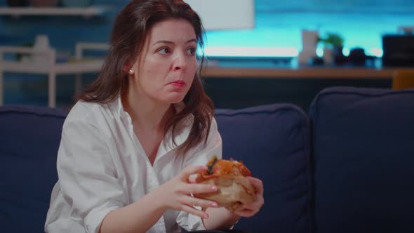 Close Up of Businesswoman Eating Fast Food Meal on Couch