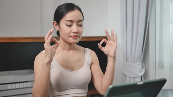 Asian girl in sportswear after exercising to maintain health She meditated 