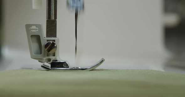 Dressmaker Working on Sewing Machine Closeup