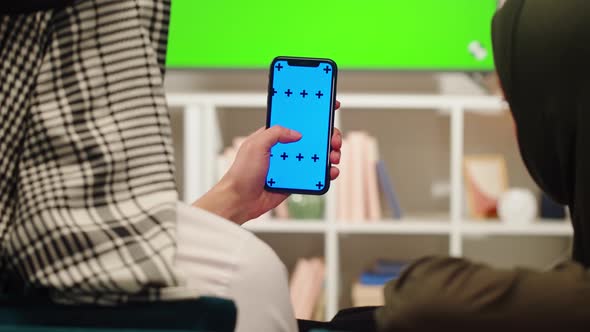 Middle Eastern Family Using Phone with Chroma Key Closeup alt