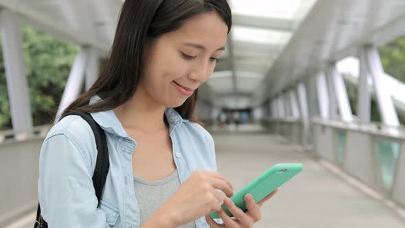 Woman use of mobile phone at street