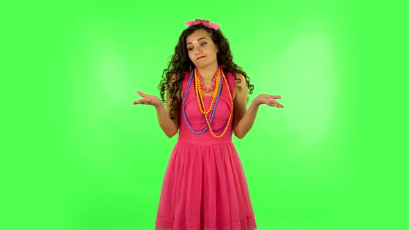 Upset Girl Shrugs and Shakes Her Head Negatively. Green Screen