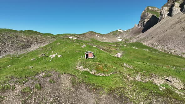 Aerial view of a wooden hut on the mountain, Moutathal, Switzerland. alt