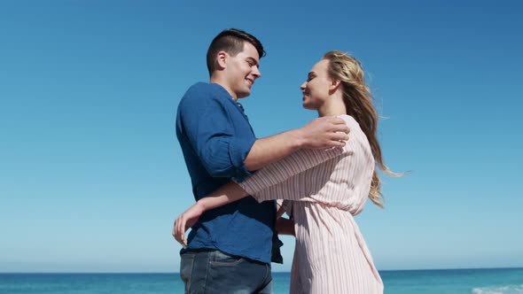 Couple in love enjoying free time on the beach together