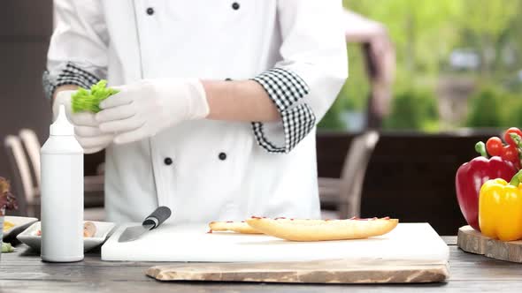 Hands Chef Making Sandwich