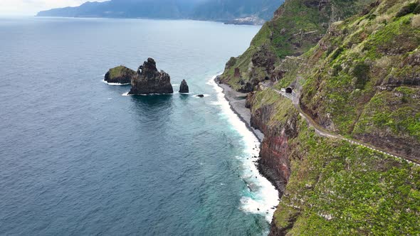 Steep Madeira coastline drops into Atlantic, Porto Moniz craggy islets