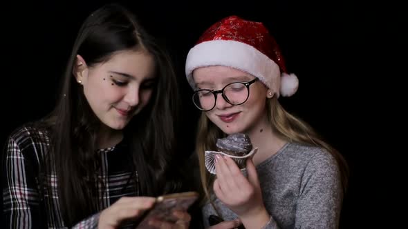 Friendship, technology and internet concept - three smiling teenage girls with smartphones