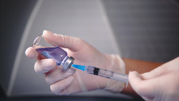 Filling Medicine From Ampoule Into Syringe