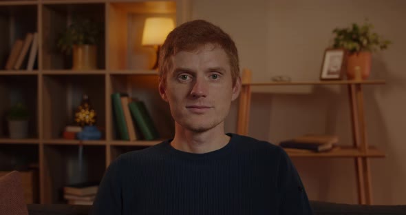 Portrait of Red Haired Man with Green Eyes Looking To Camera