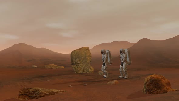 Two Astronauts Wearing Space Suit Walking On The Surface Of Mars