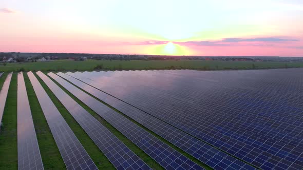 Drone Fly Over Solar Farm. Renewable Green Energy and Electrical Technology. Field of Solar Panels