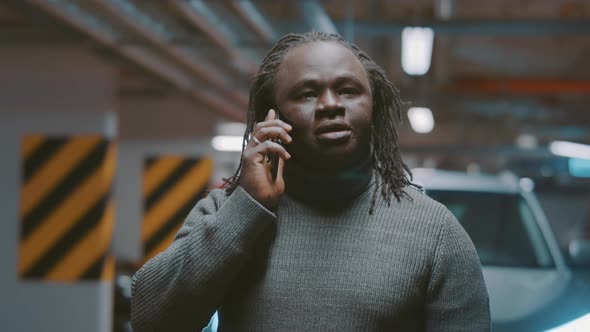 Portrait of Upset African American Black Man on the Phone Call Tapping His Forehead After Unpleasant