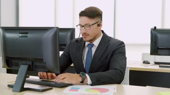 Business People Wearing Headset Working in Office