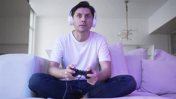 Young Man Plays Catch Game with Controller Nonstop and Lost