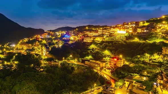 day to night time lapse of Jiufen village with mountain in raining day, Taiwan