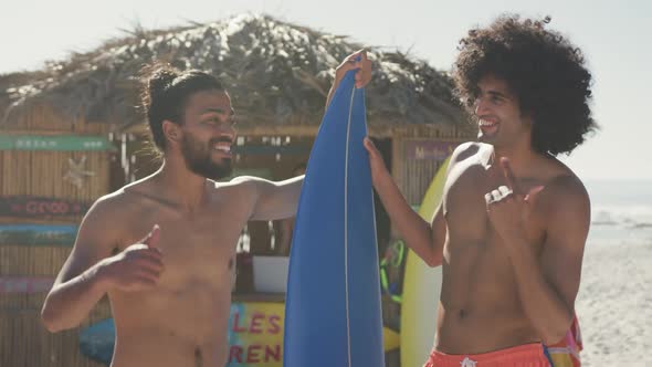 Mixed race friendsready to go surf