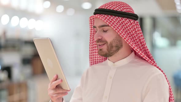 Portrait of Arab Businessman Doing Video Call on Digital Tablet