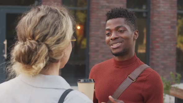 African American Businessman Talking to Female Colleague