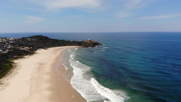 Aerial Slow Motion View of Sandy Beach and Blue Ocean at Port Macquarie Australia, Cape Point in Bac