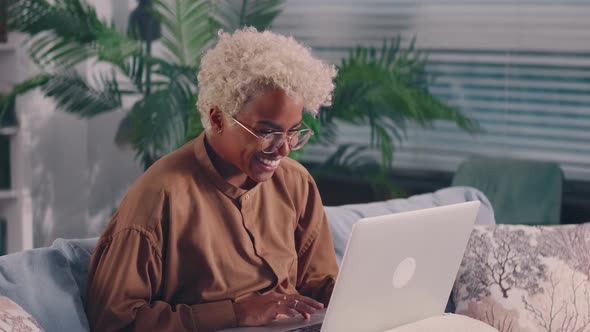 Young African Woman Read Great Commercial Offer on Laptop Feels Excited