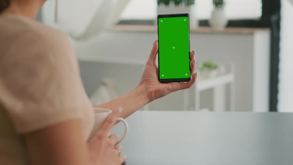 Business Woman Browsing on Internet Using Mock Up Green Screen Chroma Key Smartphone