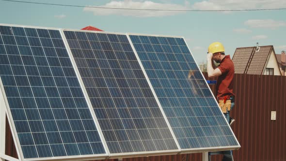 Engineer Installing Solar Cells