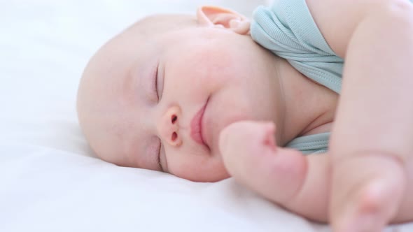 Closeup Portrait of Sleeping Infant Three Months Baby Yawning in Dream