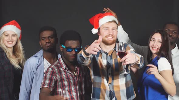 Young Mixed Race Friends Dancing at Christmas Party in Studio