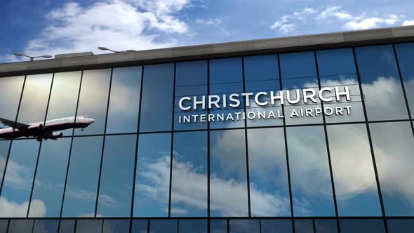 Airplane landing at Christchurch New Zealand airport mirrored in terminal