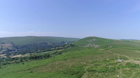 Bonehill Rocks, Wide shot aerial tracking forward over the wide expanse of Dartmoor, tors, grassy mo