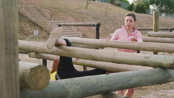 Female friends enjoying exercising at boot camp together