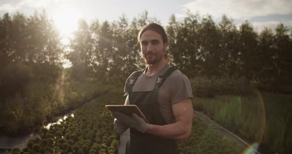 Male Farmer with Tablet in Field