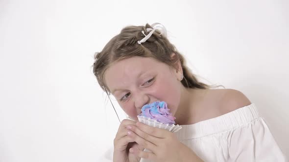 Young Woman in the Sleepwear Eating Sweet Donuts Near the Refrigerator