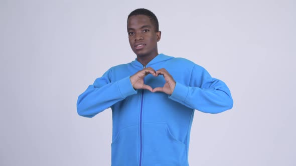 Young Happy African Man with Hand Heart Gesture