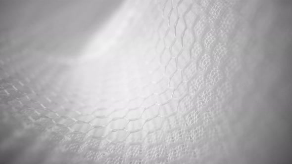 Shiny Net Cloth Flowing Texture Dolly Shot in Close Up View Macro