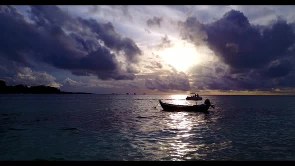 Aerial top down travel of relaxing shore beach adventure by blue water and white sand background of 