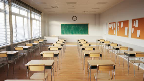 Empty classroom with chalkboard and rows of desks with chairs. Break at school.