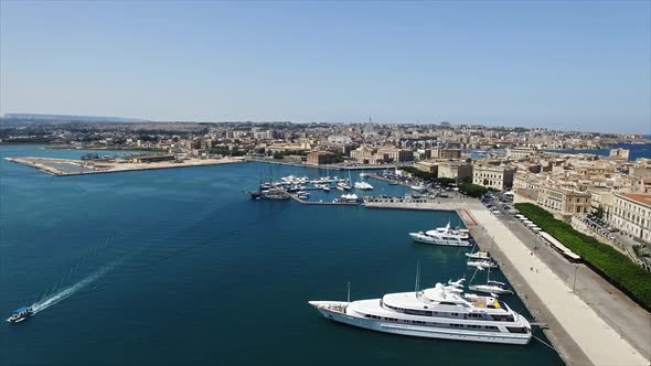 Flying Over Big Yachts Near Big City