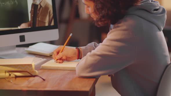 Teenage Boy Taking Online School Lesson on Video Call at Home