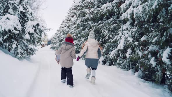 Children Running Along the Snowy Road