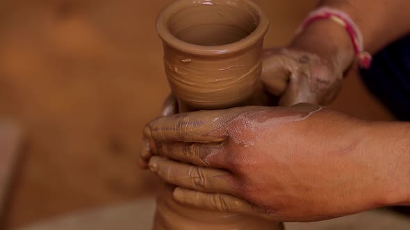 Potter at Work Makes Ceramic Dishes