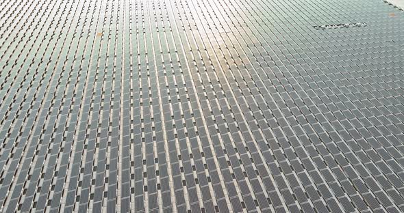 Panorama Aerial View of Floating Solar Energy Panels on a Lake