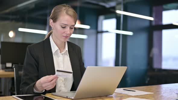 Young Businesswoman Reacting To Online Payment Failure on Laptop 