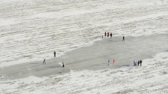 Aerial View, Crowd People Walks And Ice Skating On Outdoor Ice