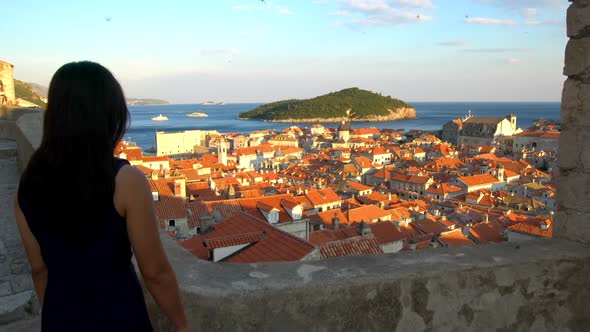 Woman Walk on Wall of Dubrovnik Old Town Croatia