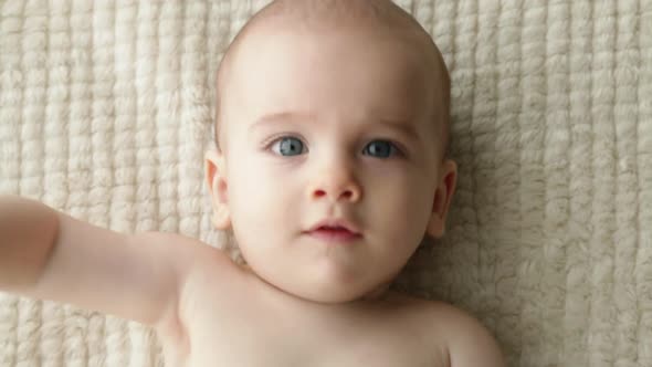 Baby Boy Lying on Blanket, from Above