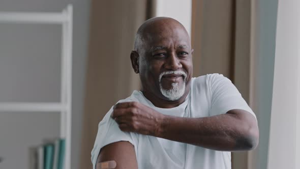 Portrait African American Old Senior Mature Man Patient Shows Medical Plaster on Shoulder