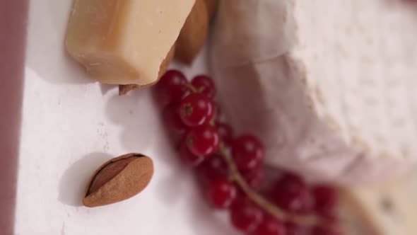 Vertical video: Close-up of mozzarella cheese and camembert